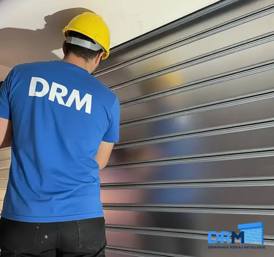 Dépannage rideau métallique en urgence — équipe DRM intervenant 24h/24 Paris 19e